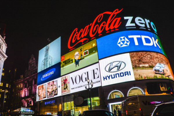 Brand logos on illuminated billboards