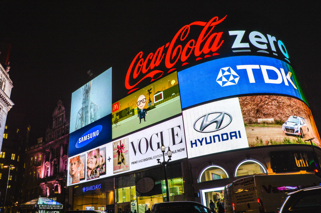Illuminated brand billboards at Piccadilly Circus at night