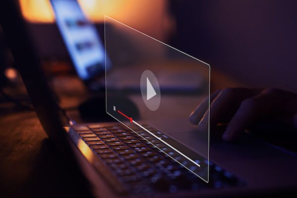 Video content playing on a laptop screen